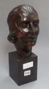 An Art Deco carved wood bust, signed
