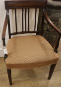 A George III mahogany elbow chair, with stuff-over seat and moulded crest rail over vertical