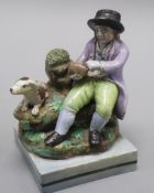 A Wood type pearlware group, c.1810 of a man with a bird's nets height 13cm