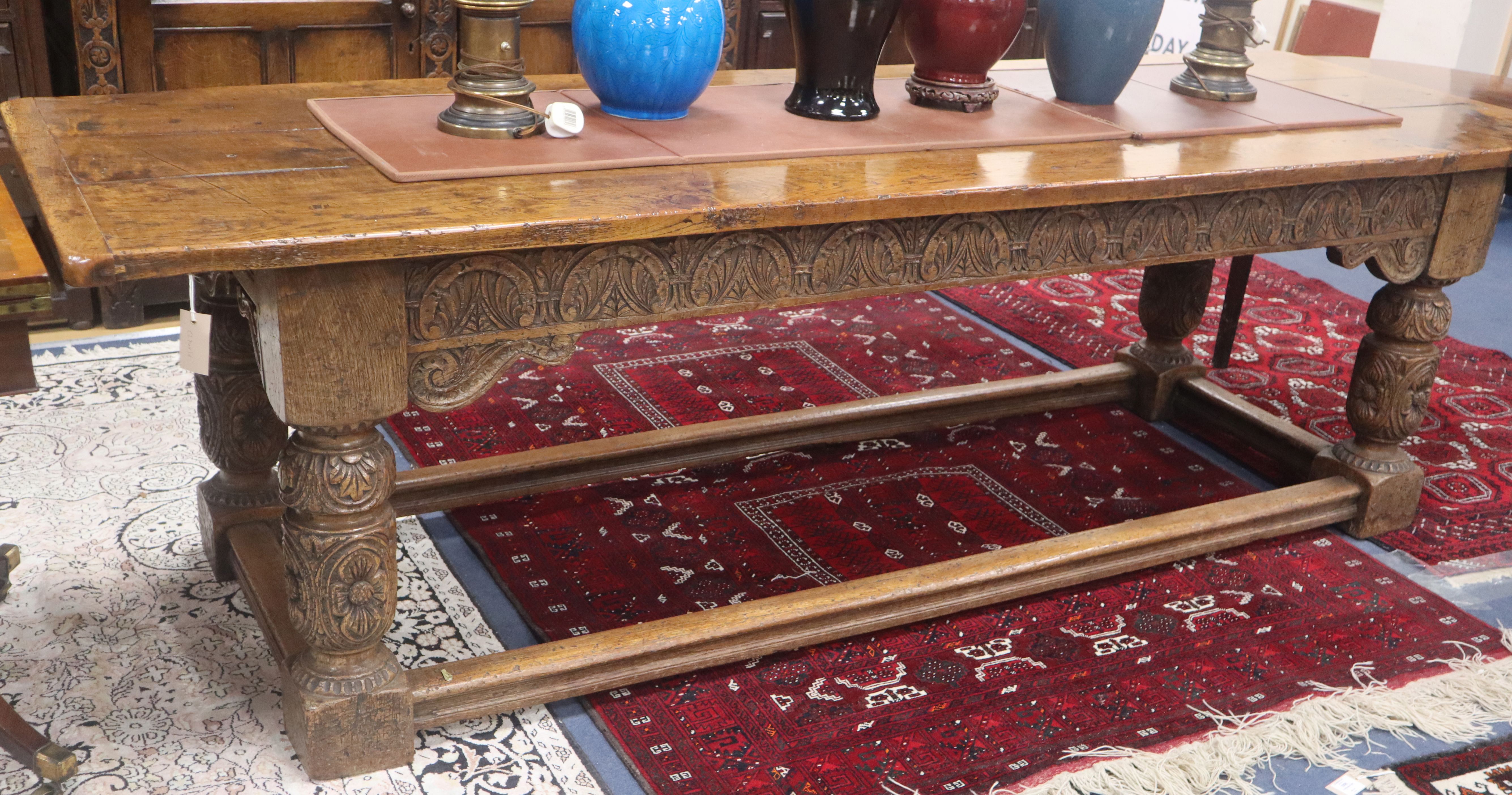 A 17th century design oak refectory dining table top 258 x 83cm