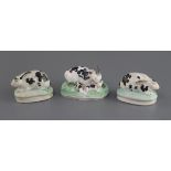 A Staffordshire porcelain group of a rabbit and young and two similar figures of rabbits, c. 1830-