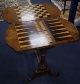 A Victorian walnut and boxwood line inlaid work / games table, the top opening to reveal a surface