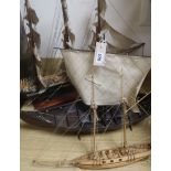 A model of a 19th century clipper, a six gun clipper and a viking long boat
