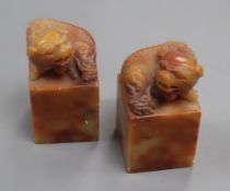 A pair of Chinese soapstone 'lion-dog' seals height 7cm