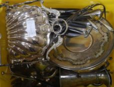 A group of assorted plated ware including cutlery and a shell shaped biscuit box