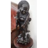 An Eastern carved hardwood figure of a deity height 54cm