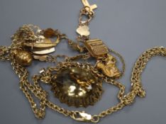 A gold and silver charm bracelet hung with seven charms and a citrine pendant in 9ct gold openwork