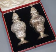 A cased pair of late Victorian silver sugar casters, Daniel & John Welby, London, 1897, 19.2cm, 14.5