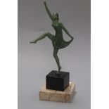 An Art Nouveau style patinated bronze of a female dancer, on marble base height 21cm