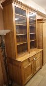 A 19th century continental pine bookcase cupboard W.130cm