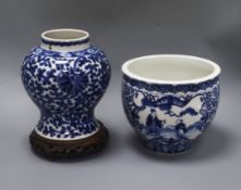 A Chinese blue and white jardiniere, Kangxi mark, and a similar vase, 20.5cm with hardwood stand