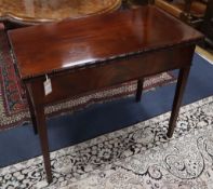 A George III mahogany rectangular topped folding tea table, the moulded edge over a matured veneered