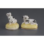 Two small Samuel Alcock porcelain figures of King Charles spaniels, c.1835-50, impressed '135'