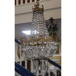 A gilt metal cut glass bag-shaped ceiling light and a pair of matching wall lights