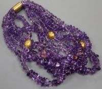 A Kiki McDonough amethyst torsade necklace, composed of five strands of tumbled graduated amethyst