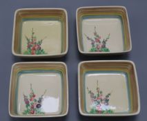 Four Clarice Cliff Hollyhock dishes length 11cm approx.