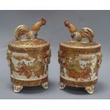 A pair of Japanese Satsuma jars and covers, with cockerel finials height 24cm