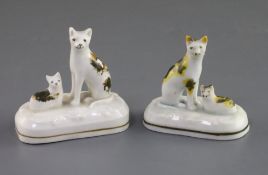 Two Staffordshire porcelain groups of a cat and kitten, c.1835-50, each with tortoiseshell markings,