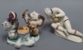 A Russian porcelain figure of a goalkeeper and a Russian porcelain inkwell