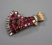 A 1950's yellow metal,ruby and diamond set fan shaped brooch, 44cm.