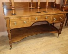 A 19th century mahogany two-tier writing table, inlaid and fitted three drawers on turned supports