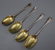 Three George I Britannia standard silver rat tail spoons, with later decoration, DA, London, 1714