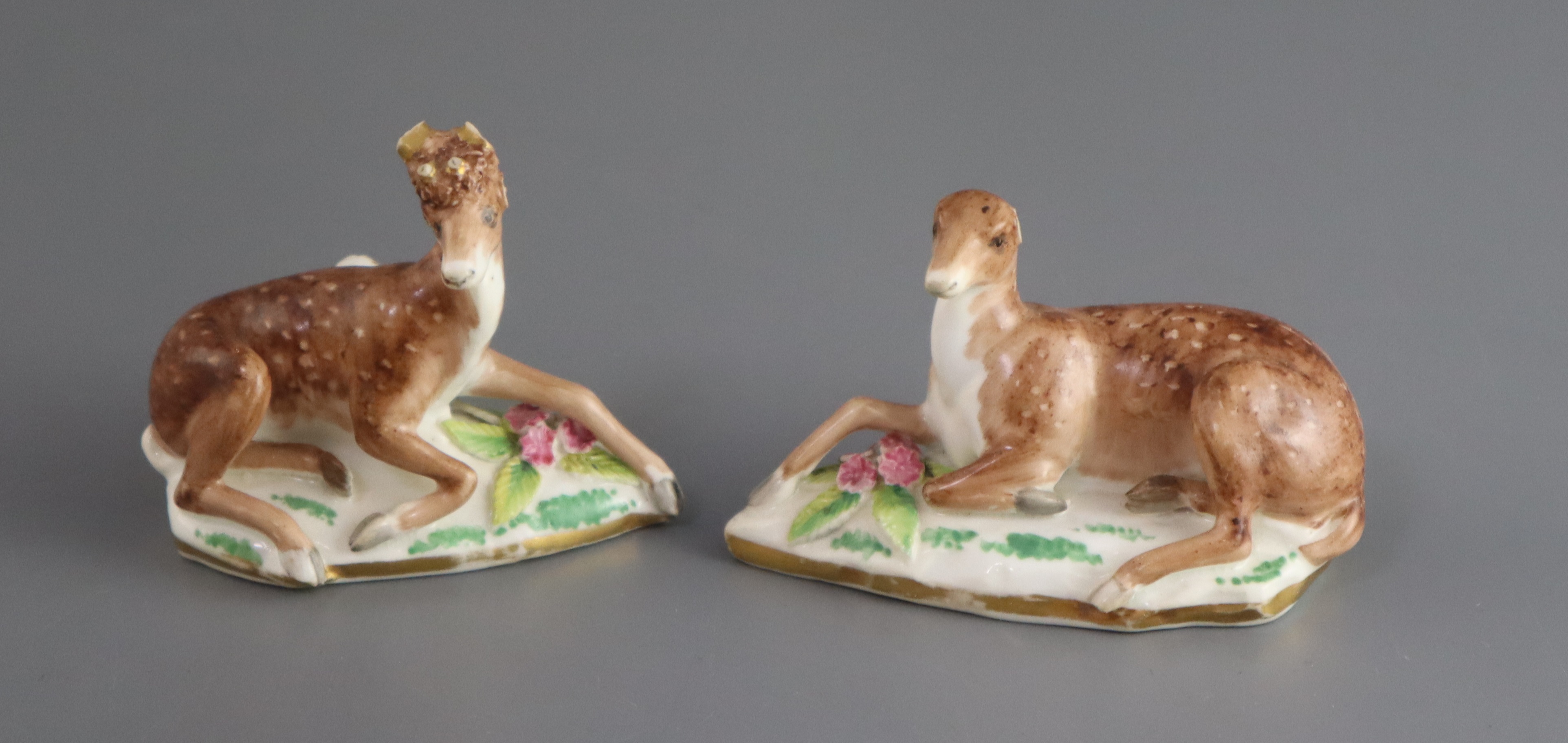 A pair of Rockingham porcelain figures of recumbent deer, c.1830, on shaped flower encrusted - Image 4 of 4