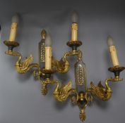 A pair of Empire-style cut metal twin branch wall lights