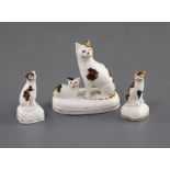 A Staffordshire porcelain group of a seated cat and kitten and two similar figures of kittens, c.