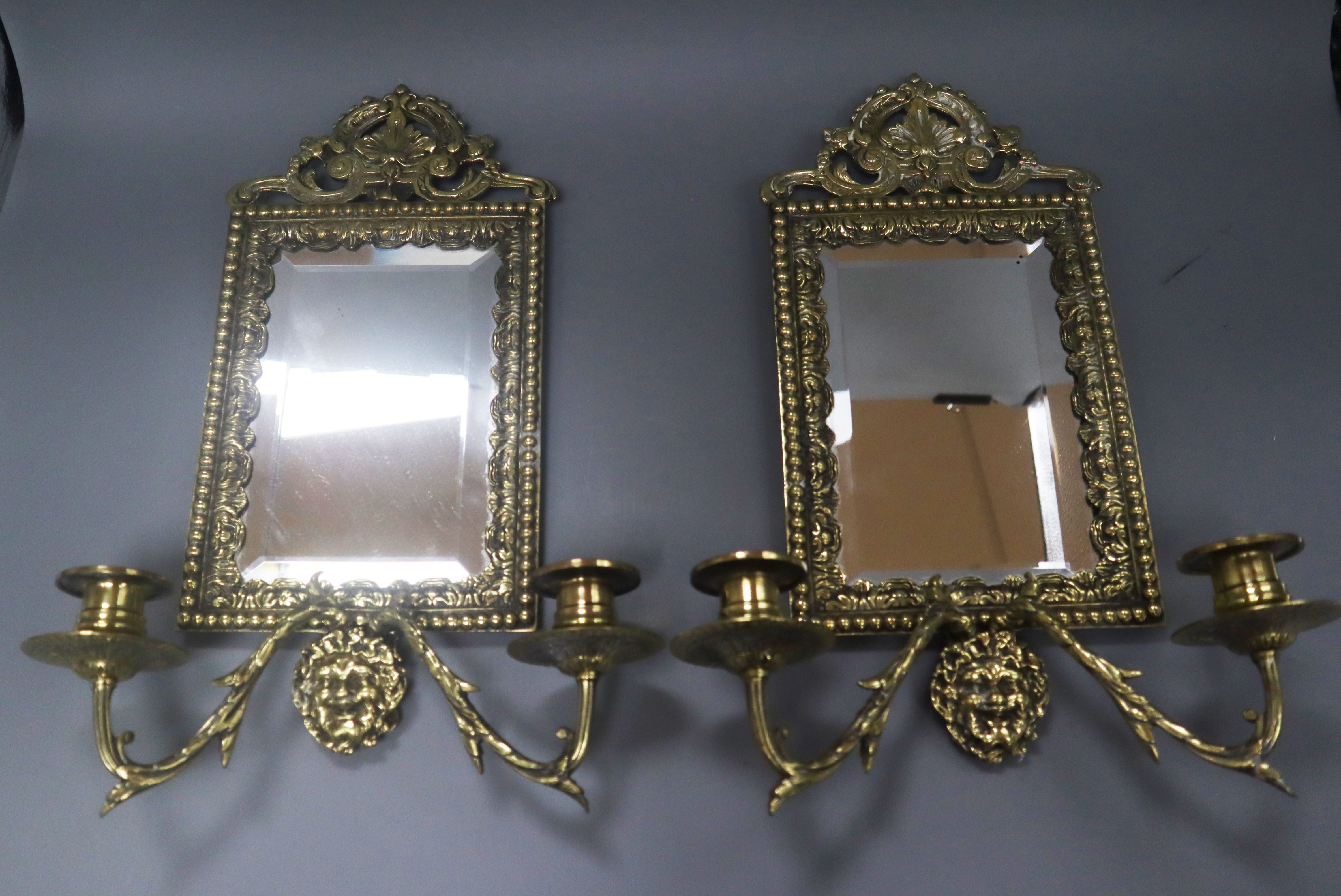 A pair of brass girandoles height 34cm