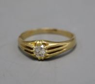 A George V 18ct gold and claw set solitaire diamond ring, the stone weighing approximately 0.