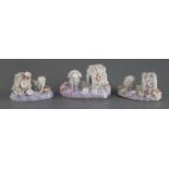 Three Staffordshire porcelain figures of a poodle and kennel, c.1835-45, with textured fur and