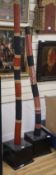 Two Aboriginal staffs and an ethnographic tall wood figure, H.210cm