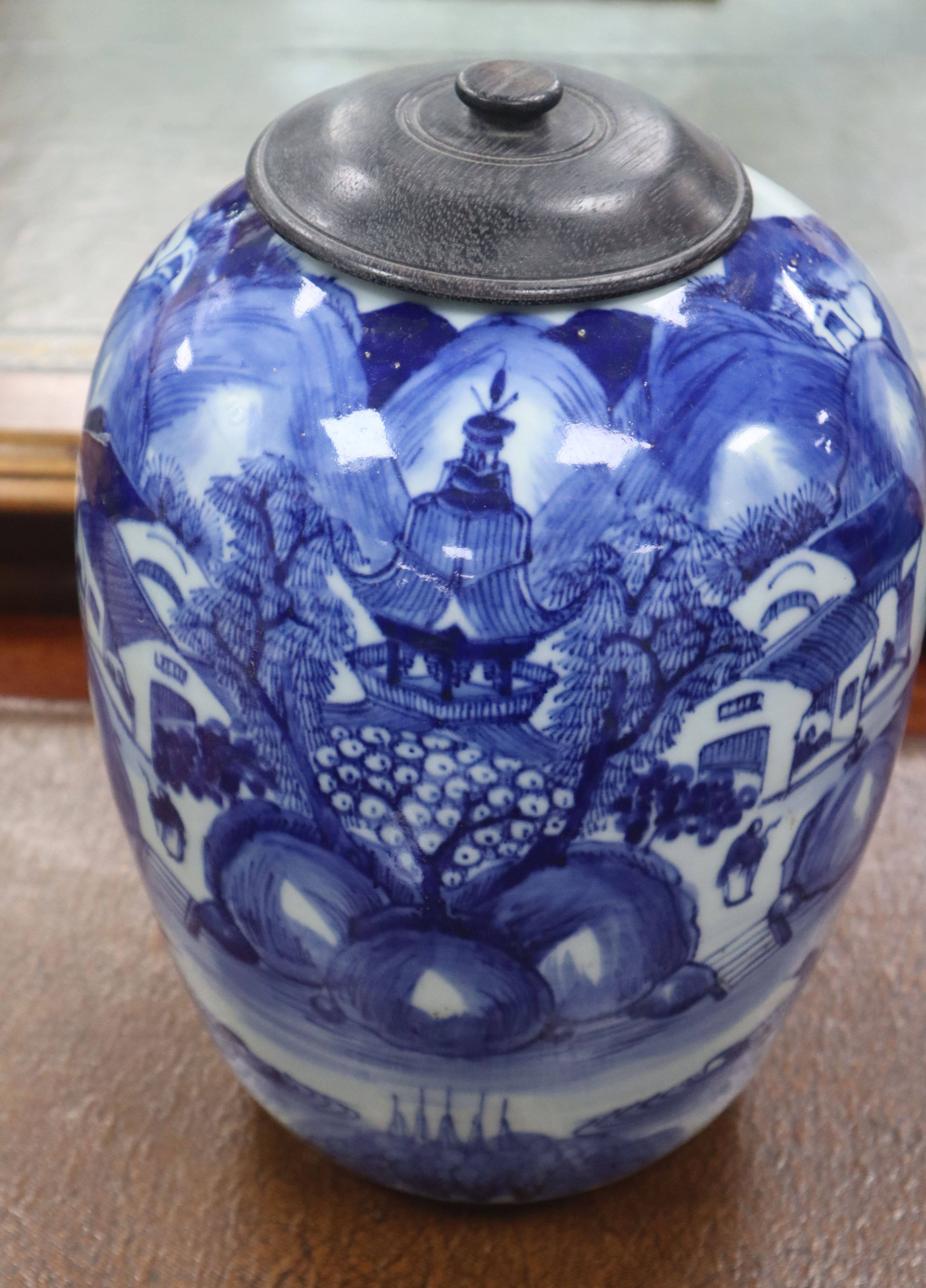 A 19th century Chinese blue and white landscape jar, wood cover height 30cm