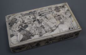 A Japanese ivory box, Meiji period with finely carved in relief with scenes of farming, 16cm