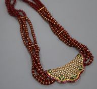 A modern Indian? yellow metal, ruby coloured glass bead, gem and diamond set necklace, 44cm.