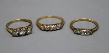 Three assorted early 20th century and later 18ct and diamond set rings, including five stone and
