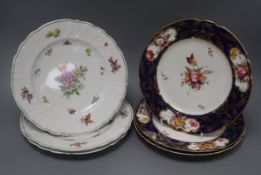 Three mid 19th century floral painted porcelain dessert plates, in the manner of Derby and a set