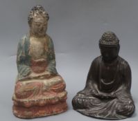 A patinated spelter figure of Buddha and a painted wood figure of Buddha tallest 31cm