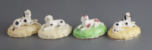 Four Samuel Alcock porcelain figures of recumbent King Charles spaniels, c.1835-50, impressed '18'