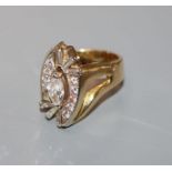 A modern 18k yellow metal, marquise, round and trapeze cut diamond set dress ring, size R/S.