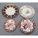 Two Royal Crown Derby Imari 'Kings' pattern plates, a Minton 'Skating' plate and a Royal Doulton