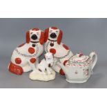 A Samuel Alcock spaniel, a Thomas Harley pearlware teapot and a pair of Staffordshire spaniels