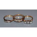 Three assorted early 20th century and later 18ct and diamond set rings, including five stone and