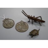 Two bronze pendants - a tortoise and a locust