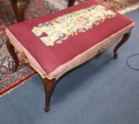 A Victorian walnut dressing stool W.110cm