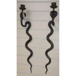 A pair of Indian snake sconces length 75cm