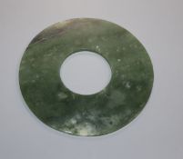 A Chinese spinach green jade bi disc 15.4cm