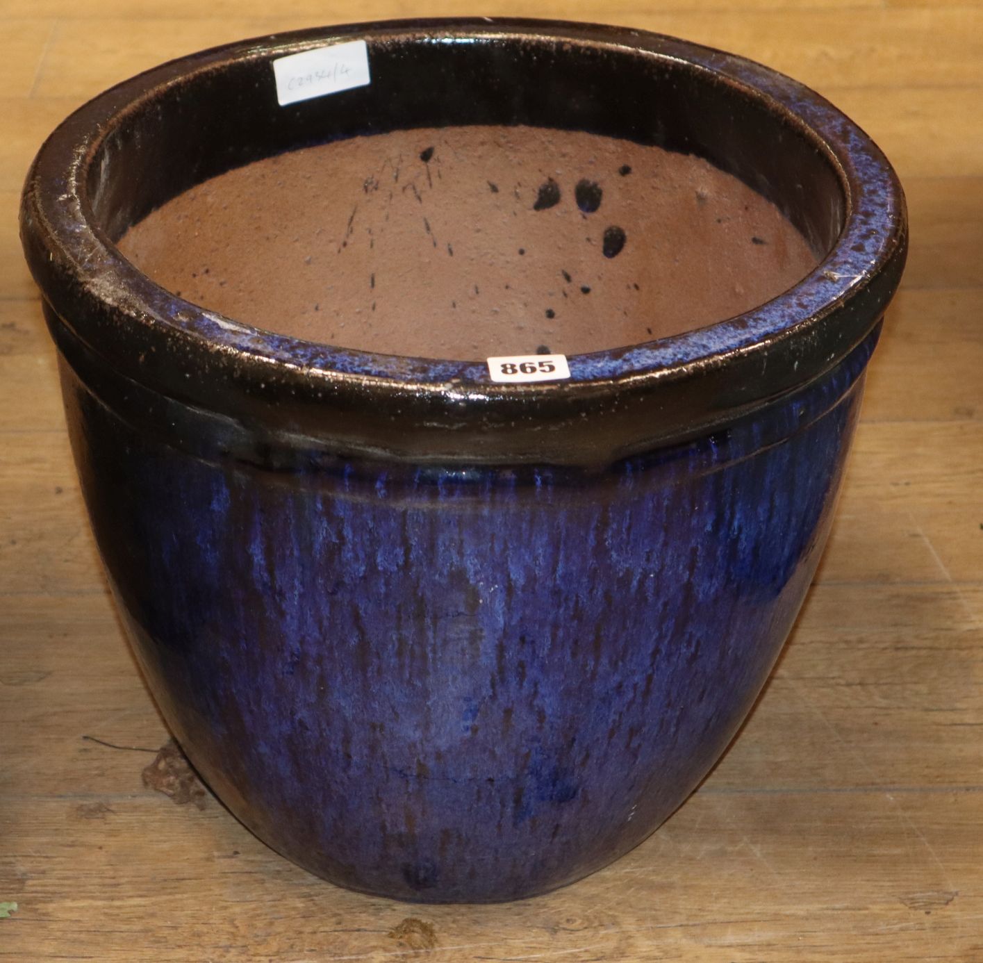 A blue glazed earthenware garden planter H.34cm