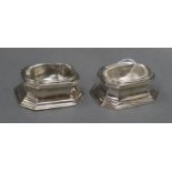 A pair of Brittania standard silver trencher salts with glass liners, Tessiers Ltd, London, 1957,